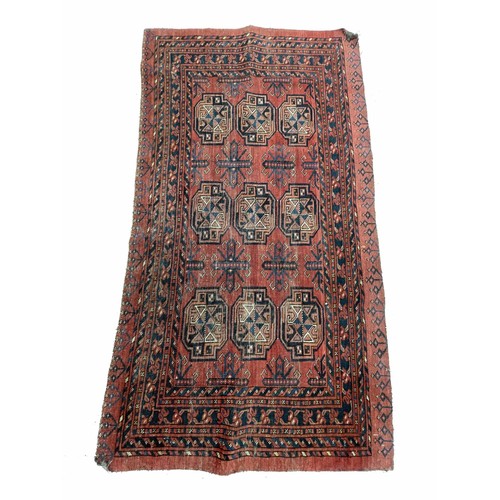 916 - Small red ground Persian pattern rug, labelled The Anglo Persian Carpet Co. Direct Importers.., 34