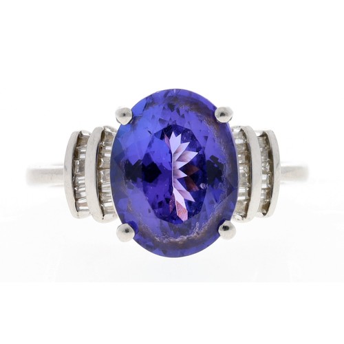 104 - Good 18ct white gold tanzanite and diamond dress ring, the tanzanite of good colour 4.70ct approx, w... 