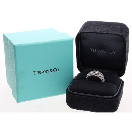 123 - Tiffany & Co. Victoria fine platinum diamond set band ring, with a combination of marquise and b... 