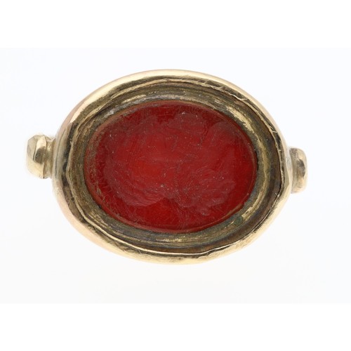 306 - 9ct red jasper oval intaglio ring, depicting a figural bust profile, width 15mm, 7.4gm, ring size N... 