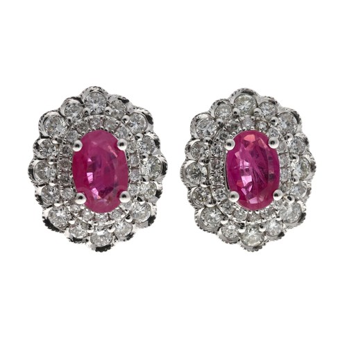 315 - Attractive modern pair of 18ct white gold ruby and diamond oval cluster earrings, the rubies each 0.... 