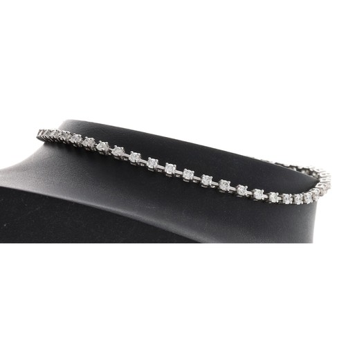 316 - Modern 18ct white gold diamond line bracelet, round brilliant-cuts, 1.40ct approx in total, width 2m... 