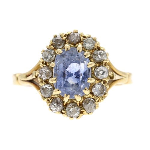 349 - Attractive 18ct sapphire and diamond oval cluster ring, the sapphire 1.25ct approx, in a border of o... 