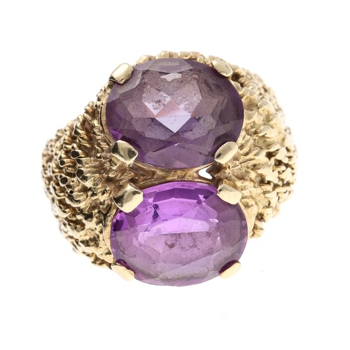 353 - Large 9ct yellow gold corundum set ring, set with two oval purple coloured stones in a rope twist de... 