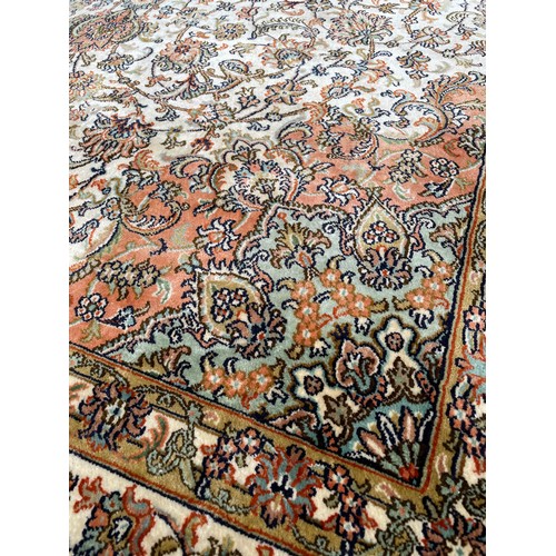 912 - Kashmir silk rug, labelled made in India, 68