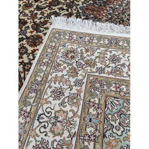 912 - Kashmir silk rug, labelled made in India, 68