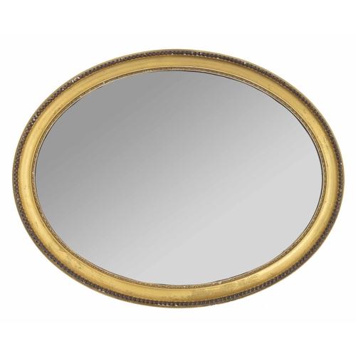 962 - Giltwood framed oval wall mirror, the bevelled glass in a beaded decorated border frame, 27