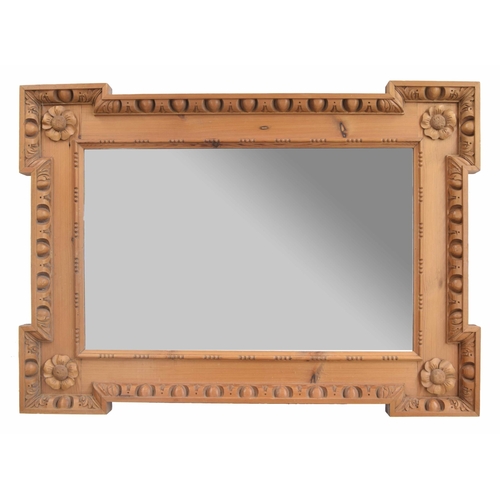 990 - Stripped pine mirror, the plain glass within a deep recessed 'Kit-Kat' style frame with flower motif... 