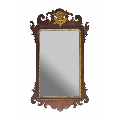 994 - Georgian mahogany fret carved wall mirror, the plain glass within a gilt highlighted frame with shap... 