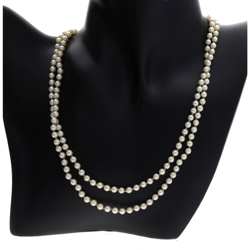 96 - Cultured pearl double strand pearl necklace, with a white metal clasp stamped '10k', the pearls 4mm,... 