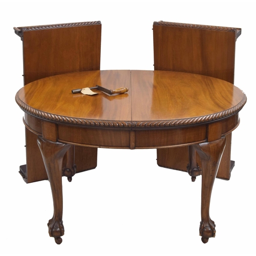 958 - Mahoagany D-end extending dining table, the top with moulded gadrooned border raised on cabriole leg... 