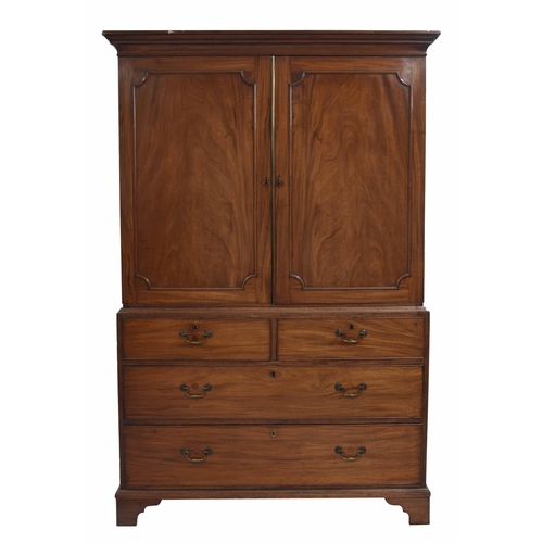 963 - Georgian mahogany linen press, the upper with two panalled doors enclosing a divided interior with s... 