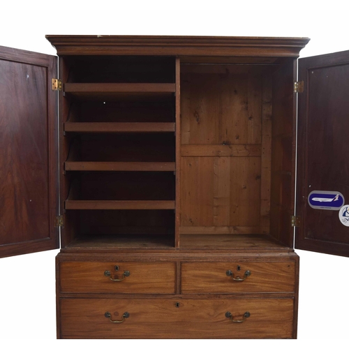 963 - Georgian mahogany linen press, the upper with two panalled doors enclosing a divided interior with s... 