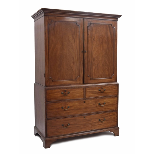 963 - Georgian mahogany linen press, the upper with two panalled doors enclosing a divided interior with s... 