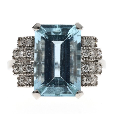 309 - Impressive 18ct white gold aquamarine and diamond dress ring in a stepped stylised setting, the emer... 