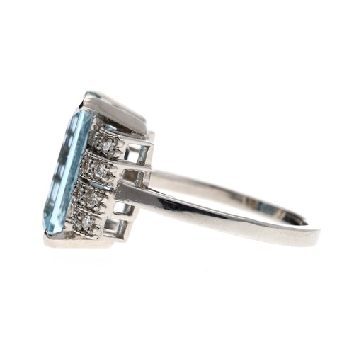 309 - Impressive 18ct white gold aquamarine and diamond dress ring in a stepped stylised setting, the emer... 