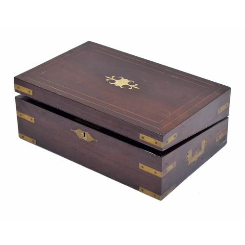 633 - Victorian rosewood and brass mounted writing slope, the hinged box revealing a two part writing surf... 