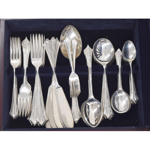 555 - United Cutlers Ltd. complete canteen of silver Art Deco pattern cutlery; comprising two table spoons... 