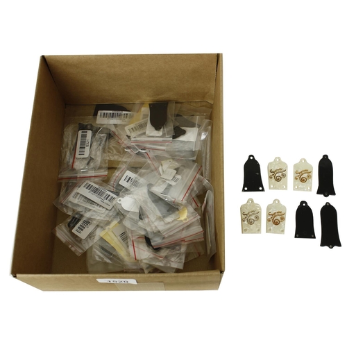 1520 - Large quantity of truss rod covers, (over forty)