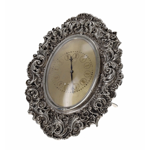 511 - Good Ornate Victorian repousse silver oval strut clock, the foliate scrolling case by Louis Dee of L... 