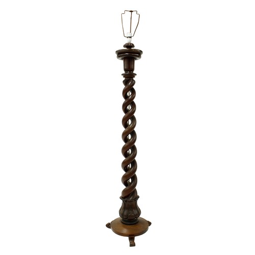 1674 - Unusual mahogany open barley twist standard lamp, the tapered column upon a circular plateau with sc... 