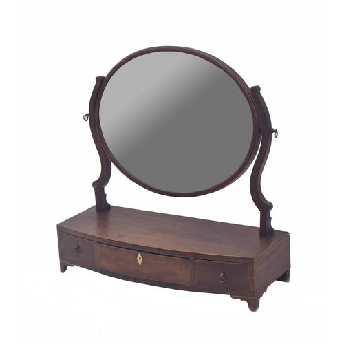 1676 - 19th century oval mahogany inlaid dressing mirror, with cheval type supports upon a bowfront box bas... 