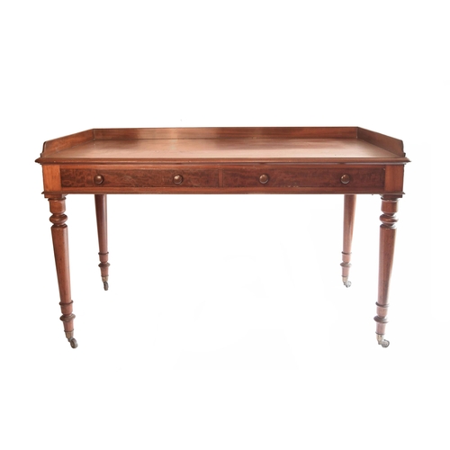 1687 - Victorian mahogany writing table, the gallery top over two frieze drawers upon turned legs terminati... 