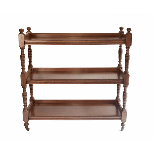 1679 - Late Victorian mahogany three tier buffet, with turned supports terminating with castors, 42