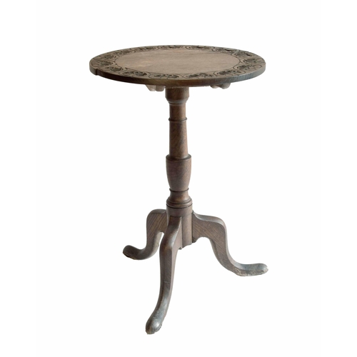 1711 - Georgian oak circular tilt-top tripod occasional table, carved with shell motifs upon a turned colum... 