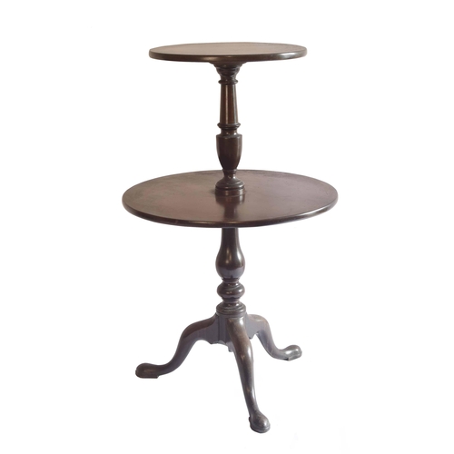 1735 - George III mahogany two tier circular dumb waiter, with baluster turned columns upon a tripod base t... 