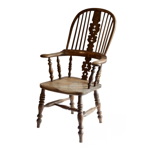 1766 - 19th century Windsor armchair, with a pierced and carved central splat and plain spindles over a sha... 