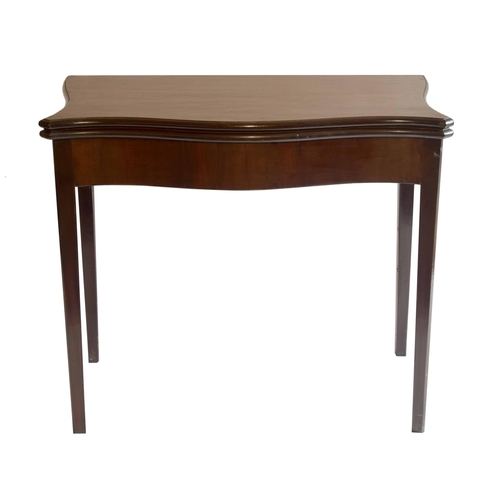 1797 - George III serpentine mahogany foldover tea table, with slender canted tapered legs, 34