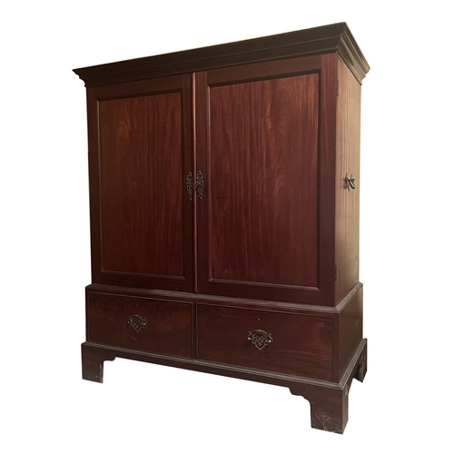 1825 - Georgian mahogany low press, with fixed side carry-handles and panelled cupboard doors over the base... 