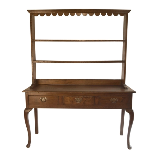 1826 - Small antique Welsh oak dresser, the open Delft rack over three drawers and upon cabriole legs, 55