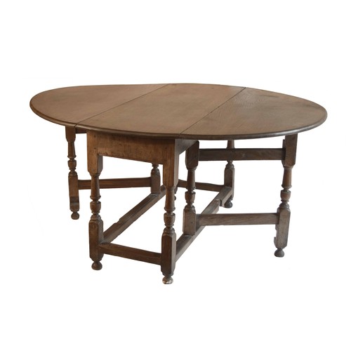 1834 - Large 18th century oak oval gateleg dining table with a single frieze end drawer upon turned support... 