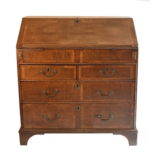 1696 - 18th century oak crossbanded bureau, the fall front enclosing a fitted interior with well over pull-... 