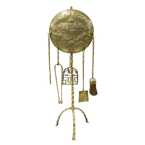 1015 - Good 19th century Dutch brass fire companion set, the stand surmounted with a circular repoussé plaq... 