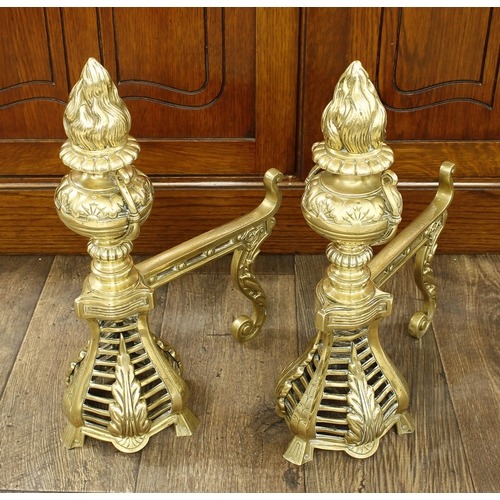 1140 - Good large decorative pair of 19th century brass andirons, each with flambaeu finials and urn type c... 