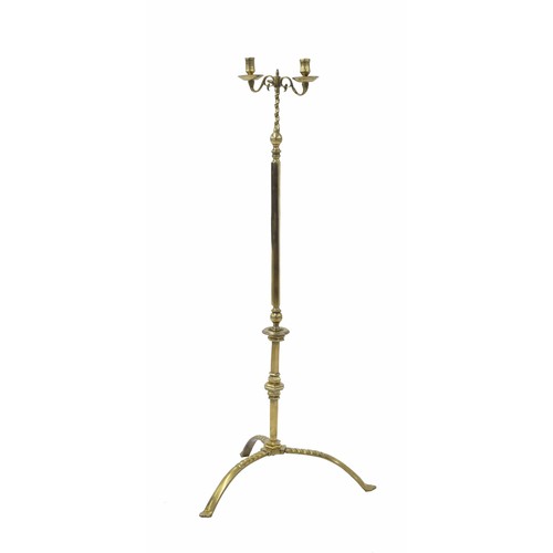 1105 - Tall polished brass tripod candle stand, with twin sconces upon hexagonal and turned column and down... 