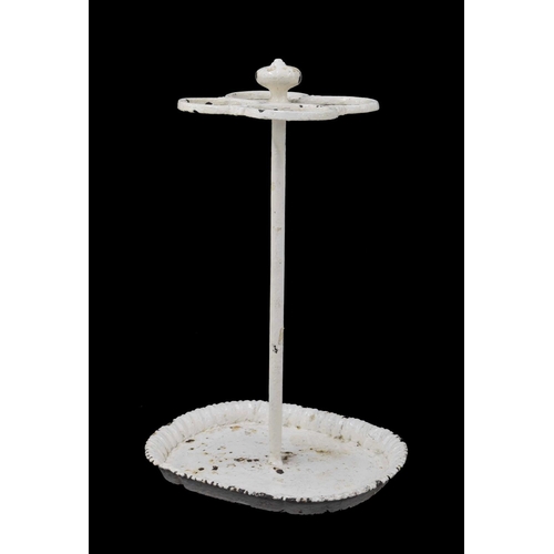 1070 - Victorian white painted cast iron four division stick stand upon an oval base, 25