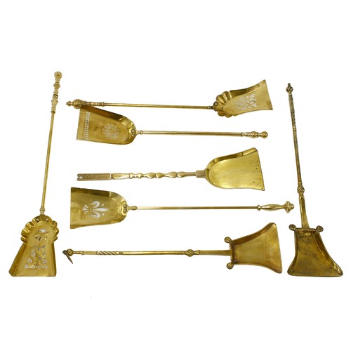 1222 - Group of seven antique polished brass fire shovels (7)