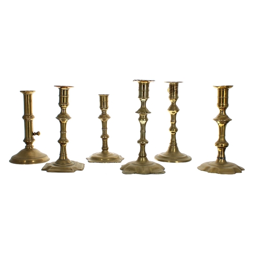 1100 - Six assorted 18th century single brass candlesticks, one with side ejector, 6.75