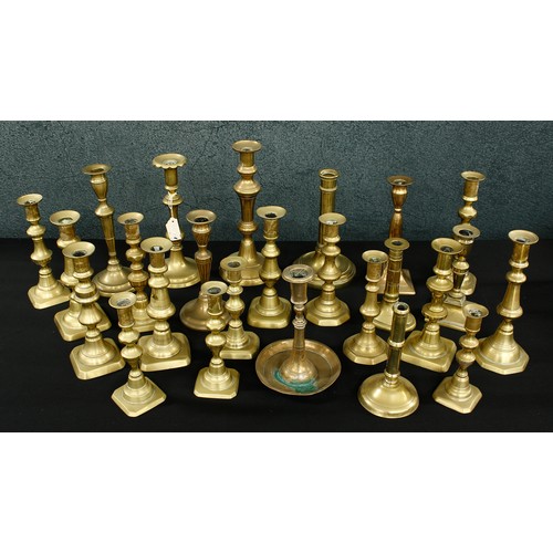 1152 - Collection of Georgian and Victorian single brass candlesticks (25)