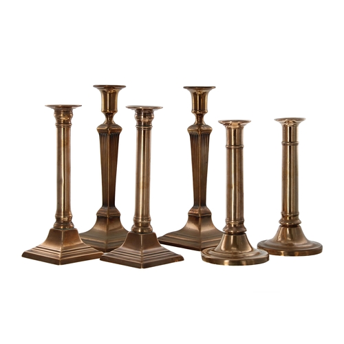 1014 - Pair of Georgian bell metal candlesticks, with square fluted tapered columns upon square bases, 10.5... 