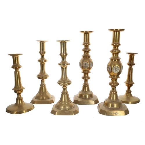 1051 - Pair of Victorian 'Good Luck' brass candlesticks, stamped to the bases, 12.5