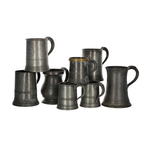 1202 - Eight 18th/19th century assorted pewter tankards, various touch marks, the tallest 7” high (8)... 