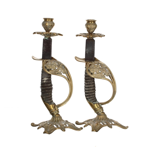 1027 - Pair of 19th century candlesticks modelled from the handles and hilts of German infantry officers sw... 