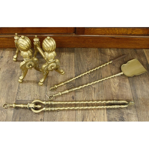 1012 - Pair of Victorian brass andirons, with wrythen fluted finials upon splayed supports with pad feet, 1... 