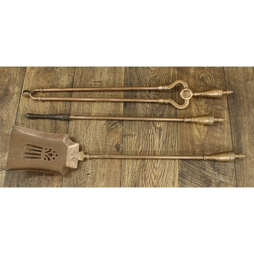 1183 - Set of three Victorian copper fire irons with turned handles, the shovel 26.75” long... 