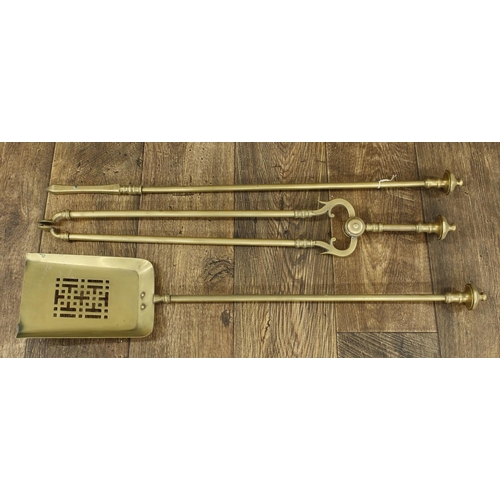 1214 - Set of three Victorian brass fire irons, with turned finials, the shovel 30” long (3)... 